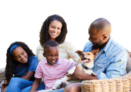 Smiling Family with Mother, Father, Two Adolescent Children and Small Dog